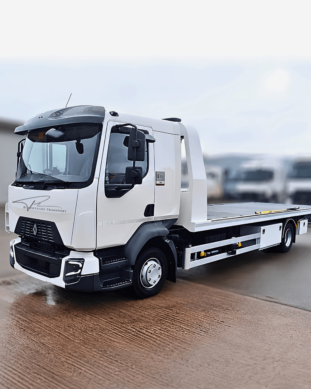 Robertsons Transport recovery truck and flatbed vehicle